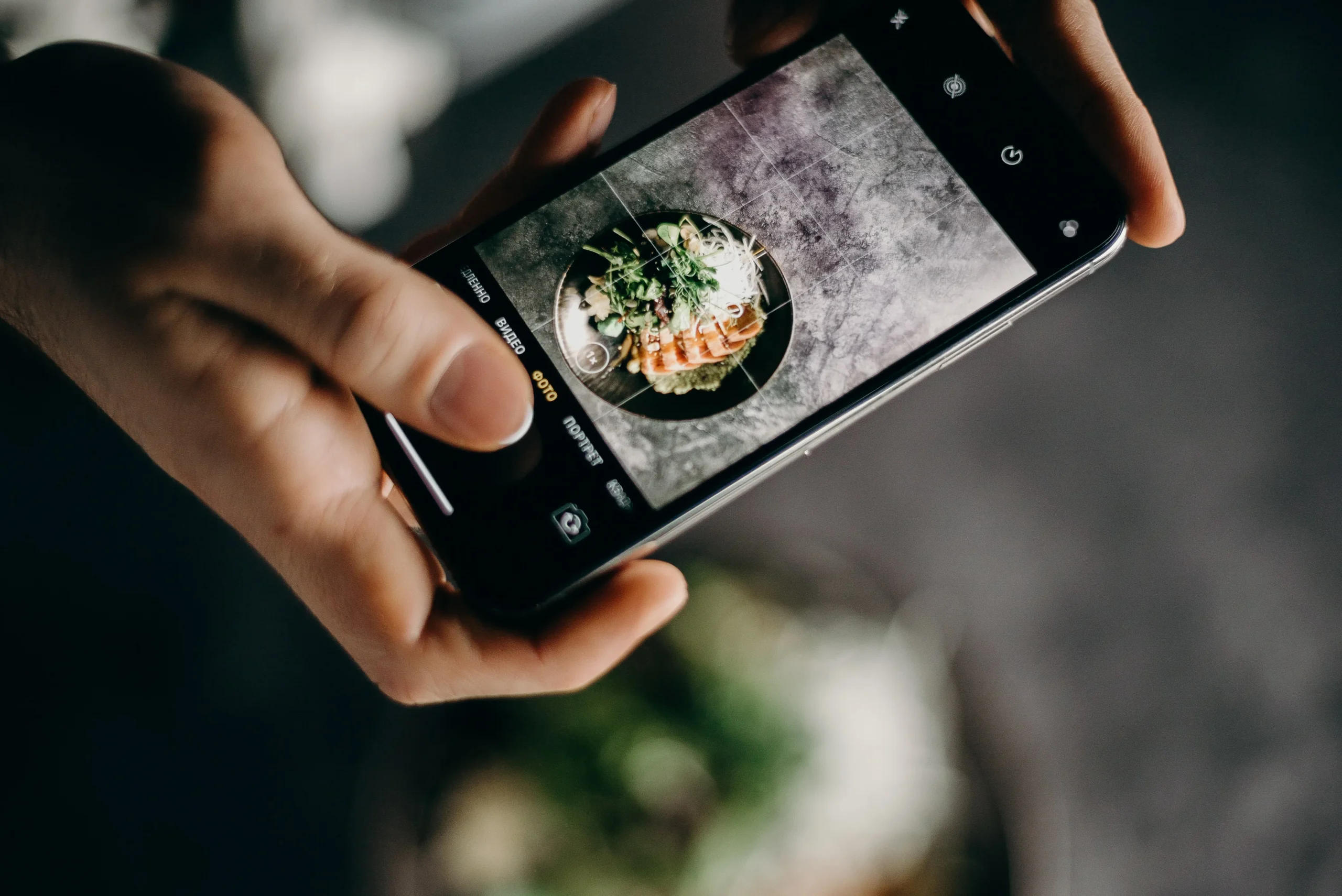 Food photography with smartphone by holding two hands