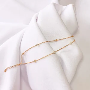 a photograph of a necklace on a white backdrop