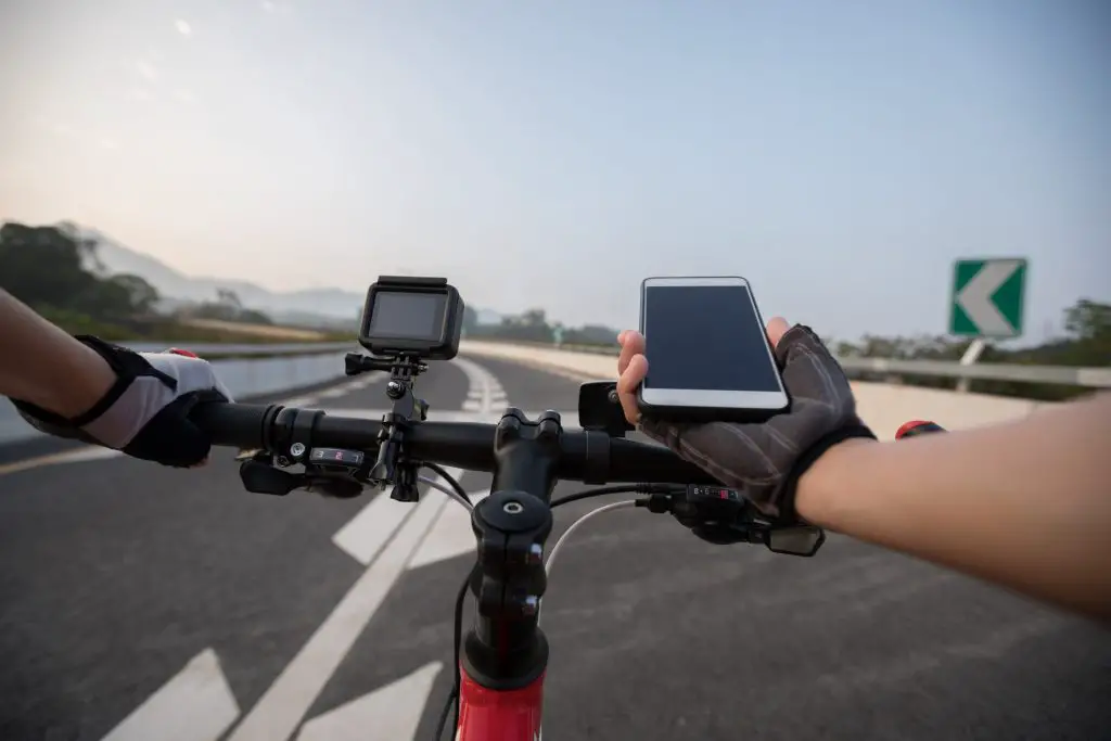 Cyclist using GoPro Camera on his handlebar taking different angle views