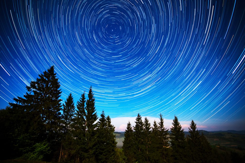 a long exposure photo of night sky