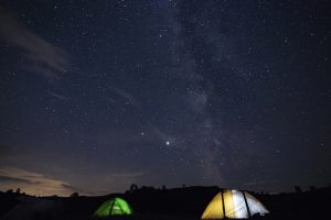 a photo of Tents and the night sky