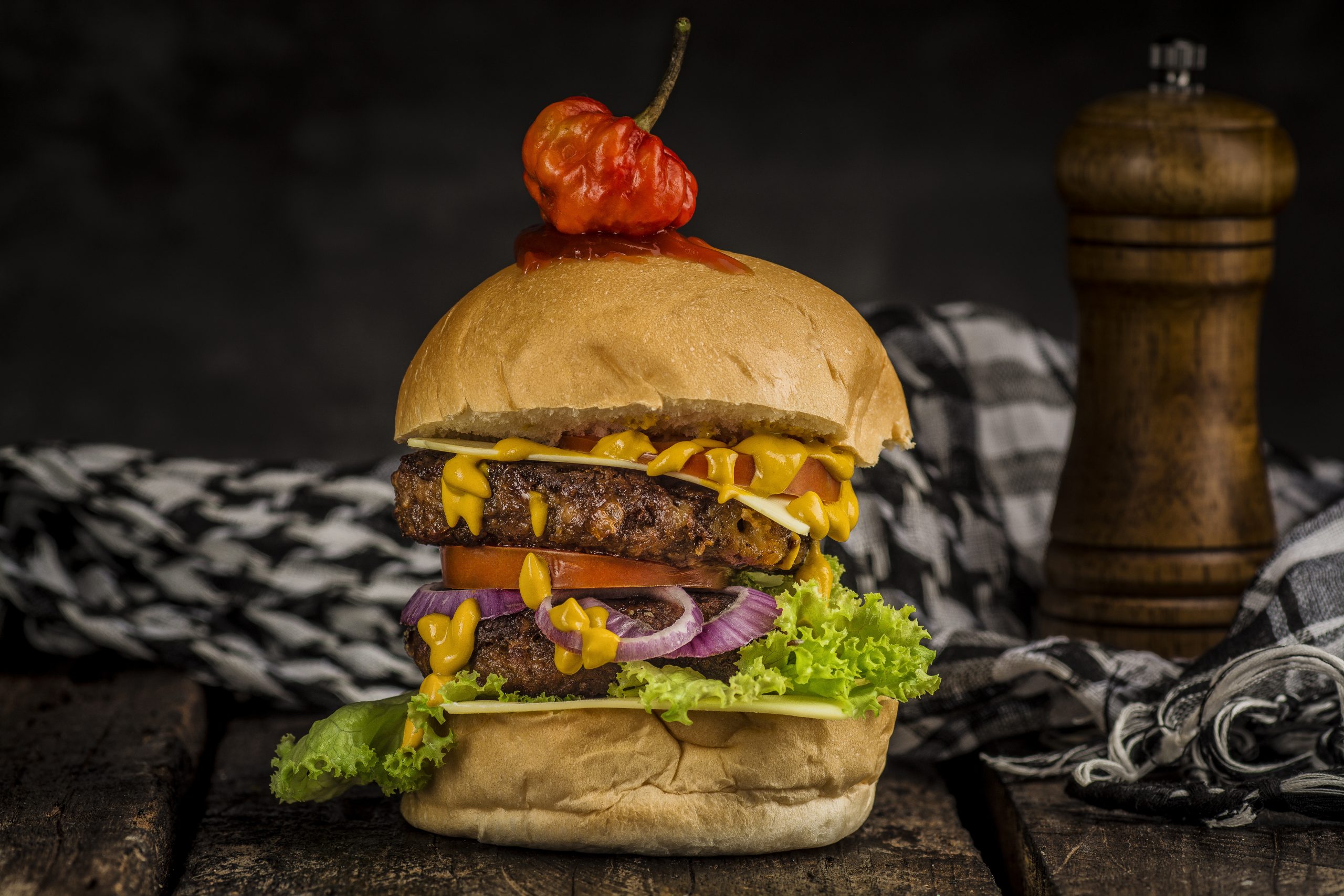 A chiaroscuro photograph of a burger 