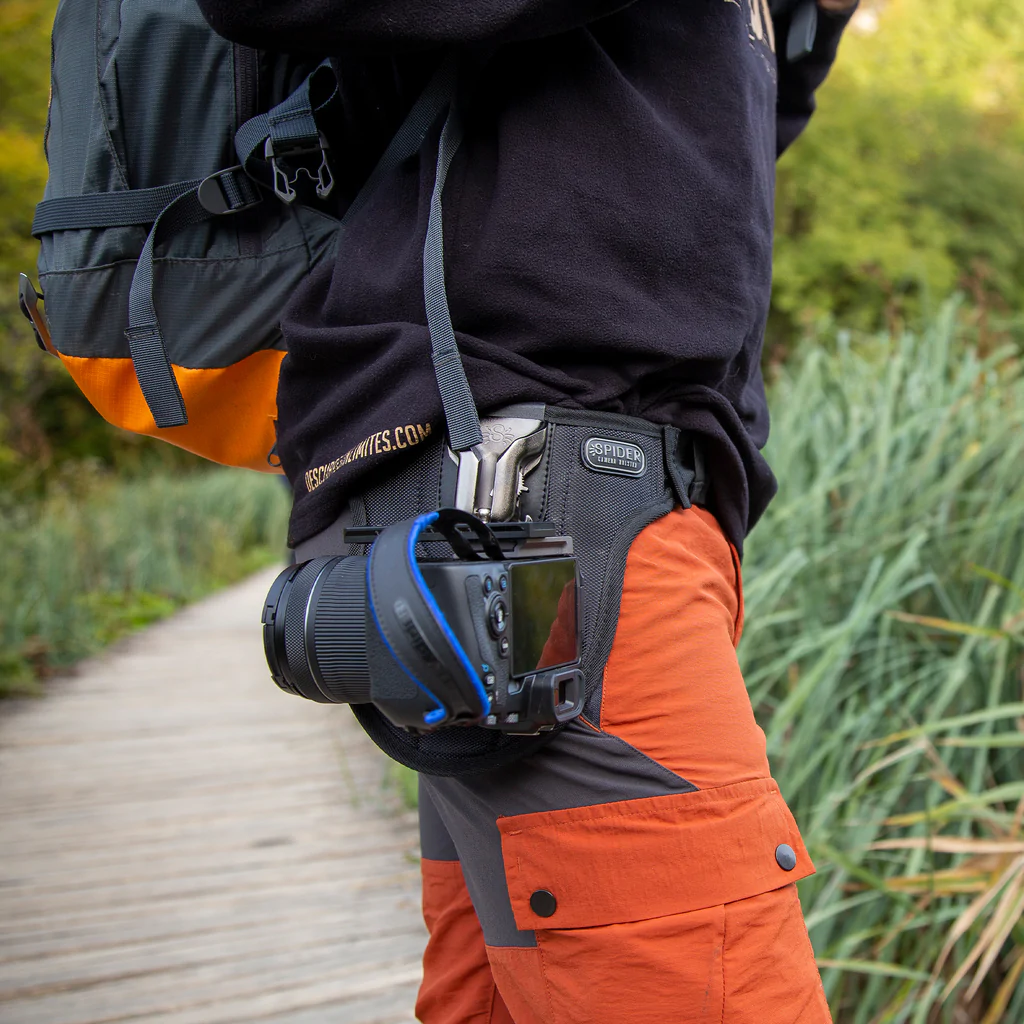 A backpacker with a Spider Holster – SpiderPro Single Camera System v2
