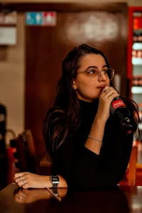 A model is drinking coca cola product