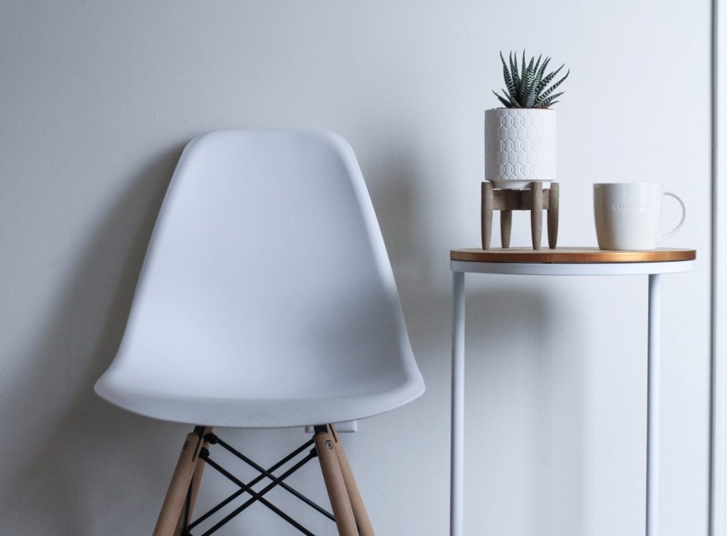 A white chair in the white background. 