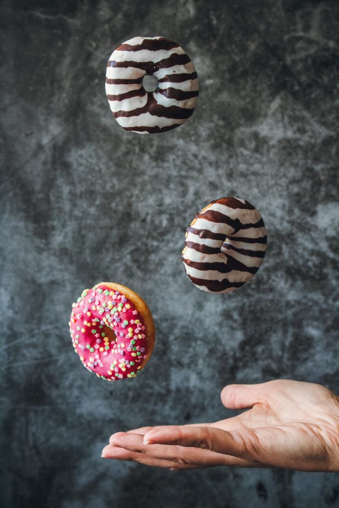 A photograph  idea of donuts in a canvas background 