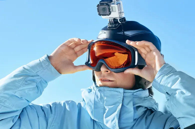 snowboarder with an action camera on his helmet.
