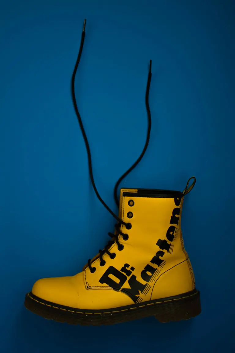Unpaired yellow lace-up boot