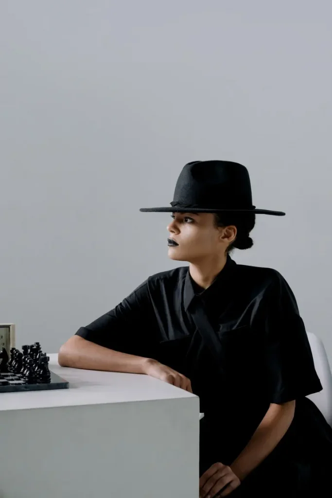 A black flat-brim hat with women