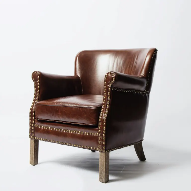 A brown leather chair on a white surface from the side view
