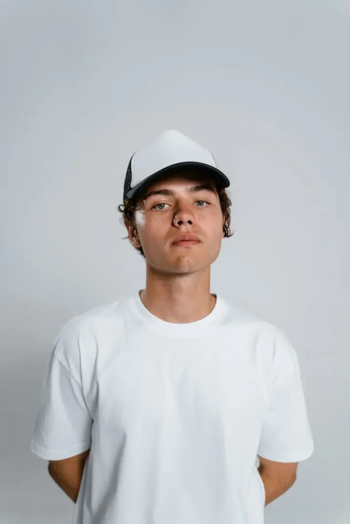 A male model wearing a cap
