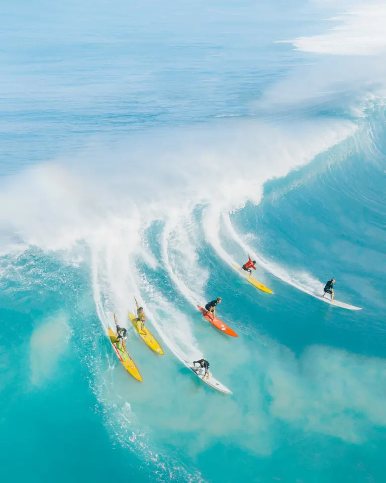 People surfing on sea waves