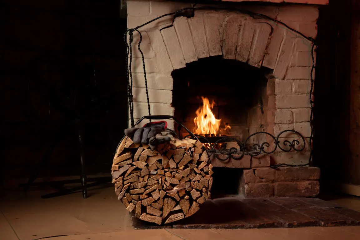 Burning firewood in a stone fireplace at home